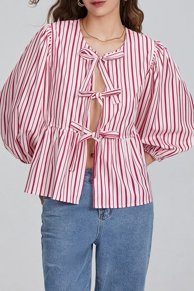 Sofia™ | Blusa con maniche a sbuffo, peplum e fiocchetti