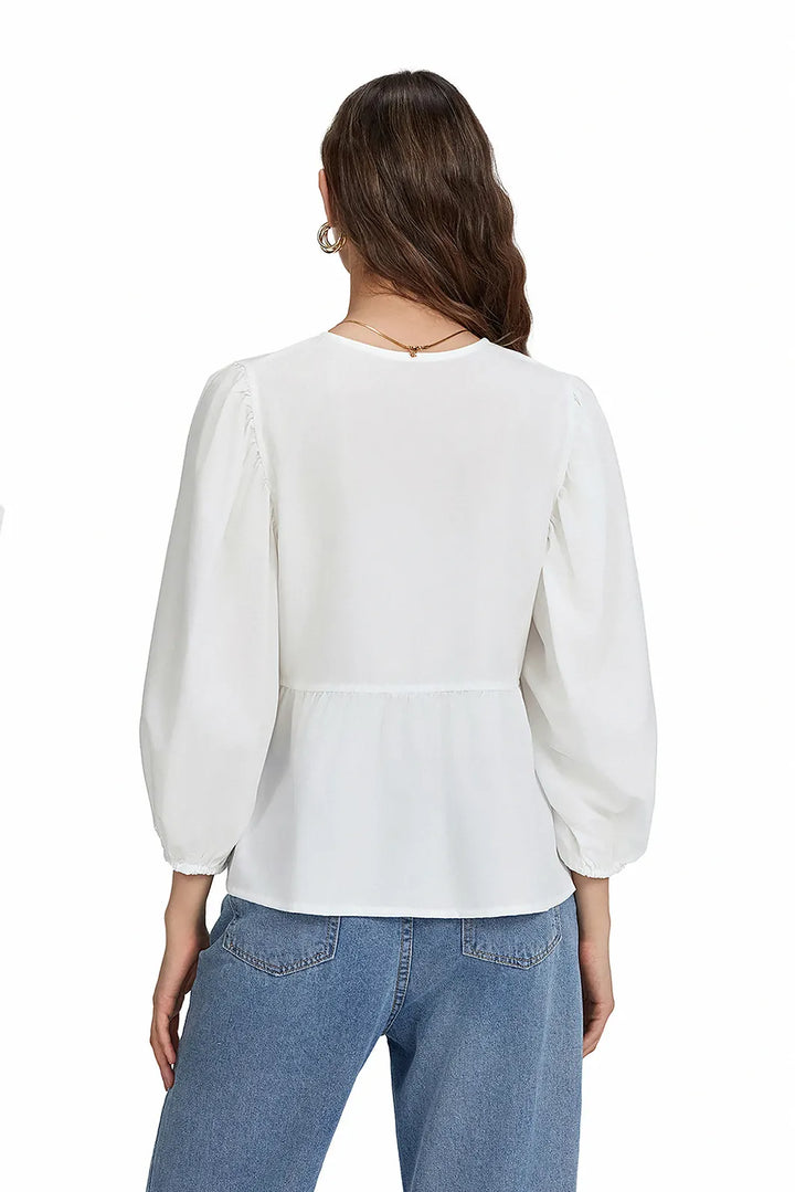 Sofia™ | Blusa con maniche a sbuffo, peplum e fiocchetti